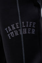 Detail Front View of Black TLF Scuba Tech Contrast Stitch Joggers, featuring side zipper pockets and contrast stitching for streetwear aesthetic 