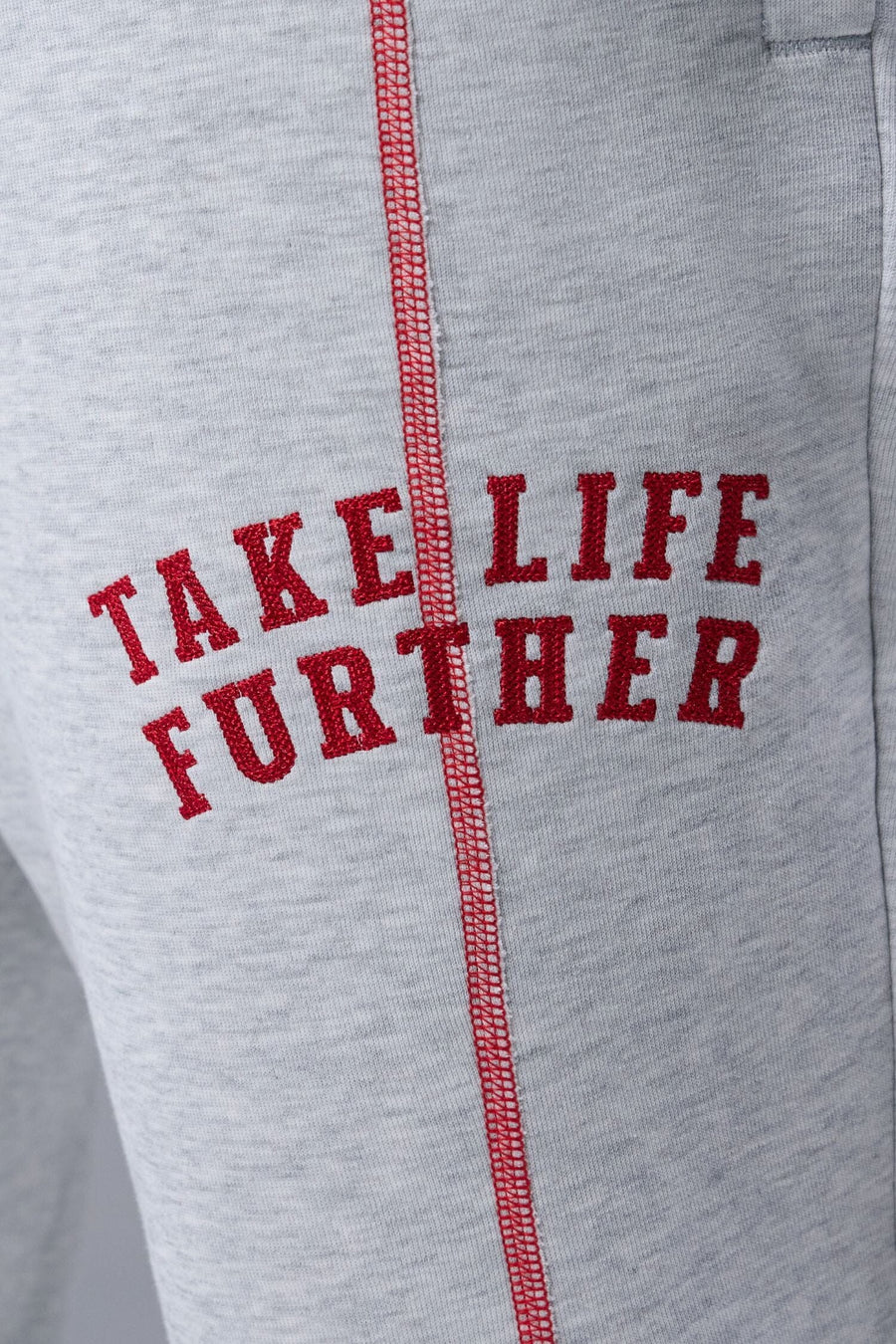 Detail Front View of Gray TLF Scuba Tech Contrast Stitch Joggers, featuring side zipper pockets and contrast stitching for streetwear aesthetic 