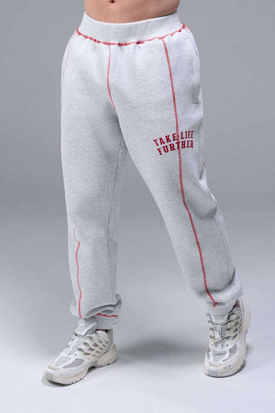 Front View of Gray TLF Scuba Tech Contrast Stitch Joggers, featuring side zipper pockets and contrast stitching for streetwear aesthetic 