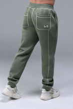 Detail Front View of Black TLF Scuba Tech Contrast Stitch Joggers, featuring side zipper pockets and contrast stitching for streetwear aesthetic 