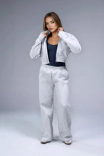 Front View of Gray TLF Scuba Tech Cropped Zip Up Jacket, featuring side zipper pockets, thumbholes and a cropped length 