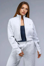 Front View of Gray TLF Scuba Tech Cropped Zip Up Jacket, featuring side zipper pockets, thumbholes and a cropped length 