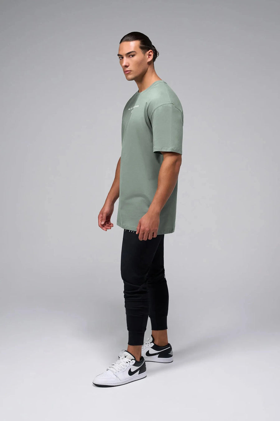 Side View Of Take Life Further Oversized Tee in Green