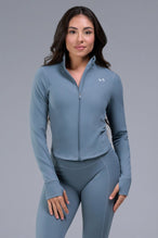 Front View of Blue TLF Tempo Cropped Zip Up Jacket featuring thumbholes and cropped length for gym and lifestyle wear 