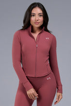 Front View of Orange TLF Tempo Cropped Zip Up Jacket featuring thumbholes and cropped length for gym and lifestyle wear 