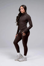 Detail View of Brown TLF Tempo Cropped Zip Up Jacket featuring thumbholes and cropped length for gym and lifestyle wear 