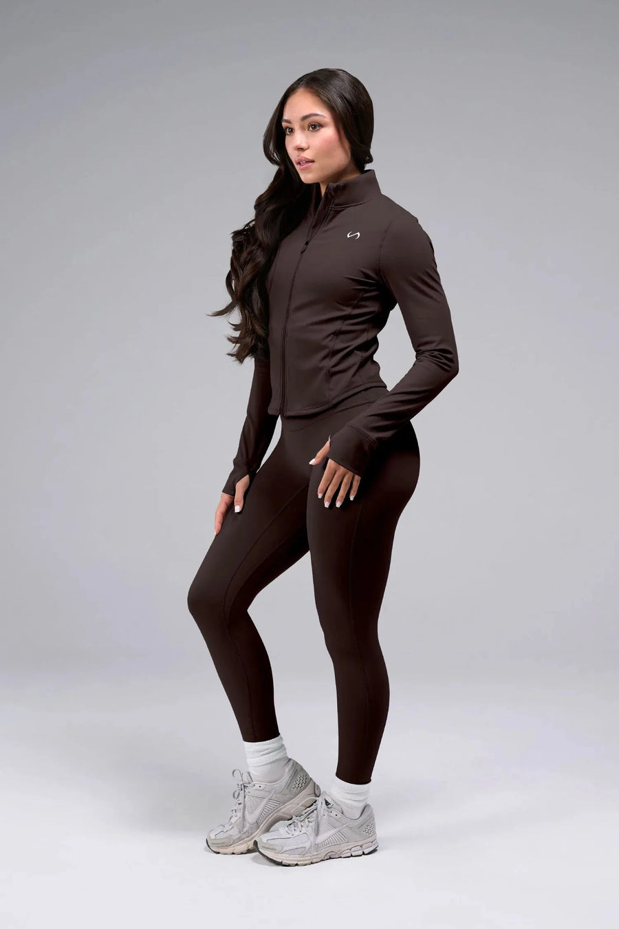 Detail View of Brown TLF Tempo Cropped Zip Up Jacket featuring thumbholes and cropped length for gym and lifestyle wear 