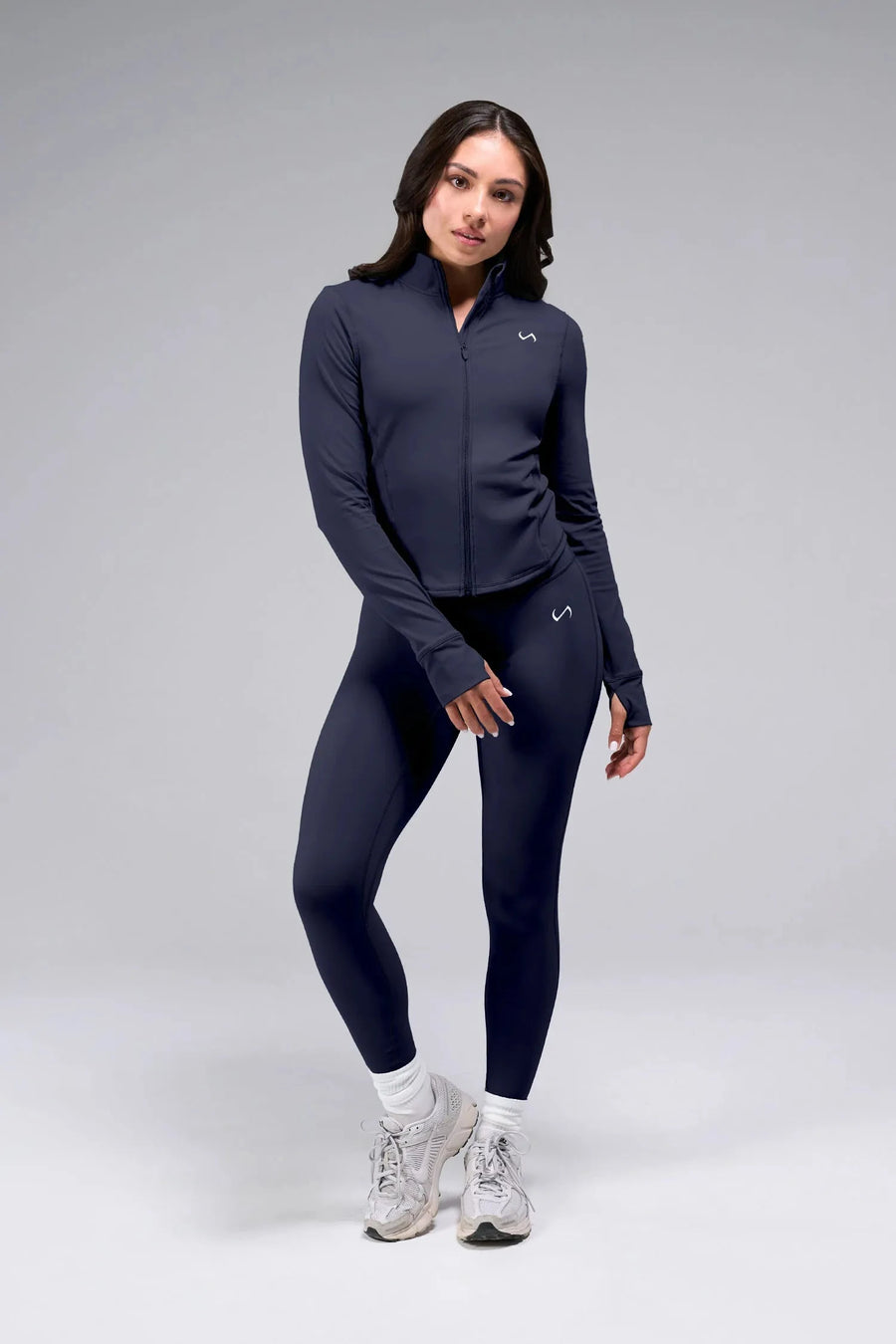 Front View of Blue TLF Tempo Cropped Zip Up Jacket featuring thumbholes and cropped length for gym and lifestyle wear 