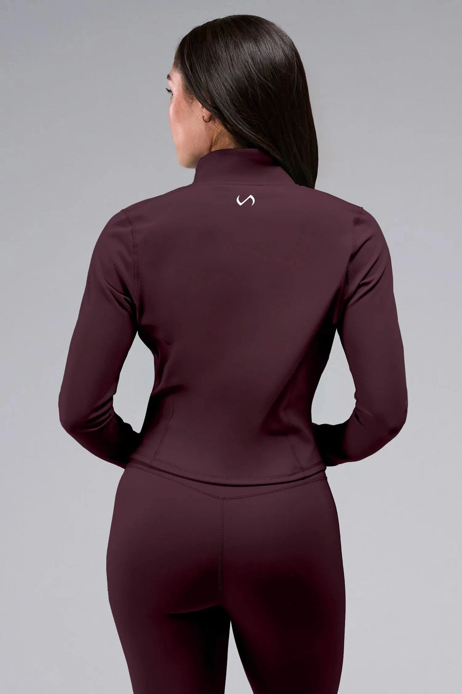 Back Front View of Wine TLF Tempo Cropped Zip Up Jacket featuring thumbholes and cropped length for gym and lifestyle wear 