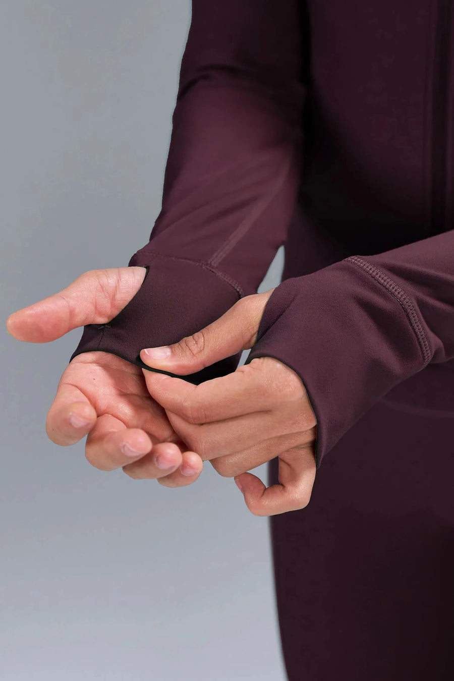 Detail  View of Wine TLF Tempo Cropped Zip Up Jacket featuring thumbholes and cropped length for gym and lifestyle wear 