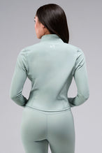Back View Of Women's Tempo Cropped Zip Up Jacket in Sage Green