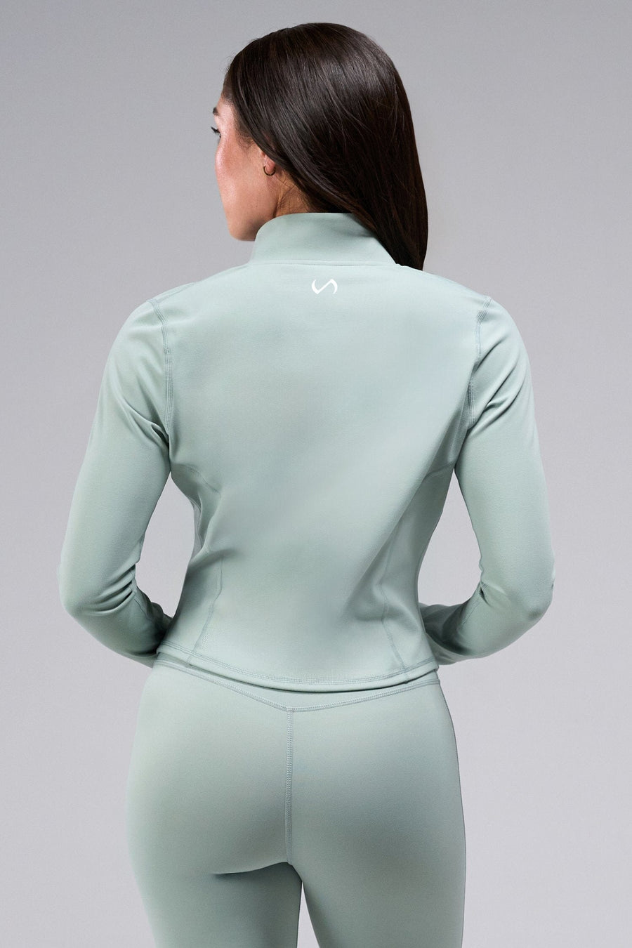 Back View Of Women's Tempo Cropped Zip Up Jacket in Sage Green