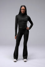 Front View of Black TLF Tempo Cropped Zip Up Jacket featuring thumbholes and cropped length for gym and lifestyle wear 