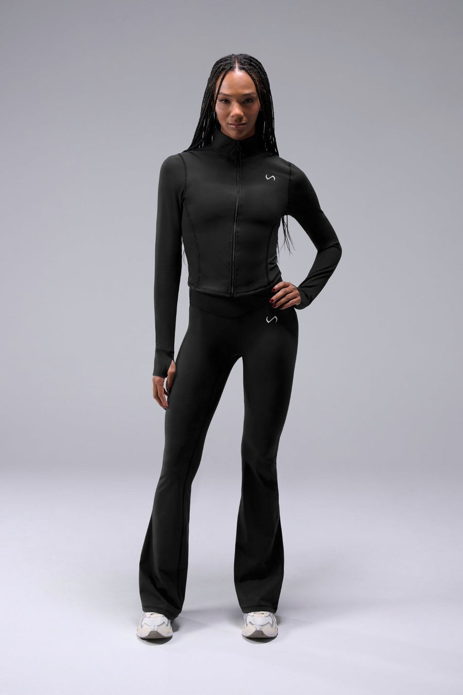 Front View of Black TLF Tempo Cropped Zip Up Jacket featuring thumbholes and cropped length for gym and lifestyle wear 
