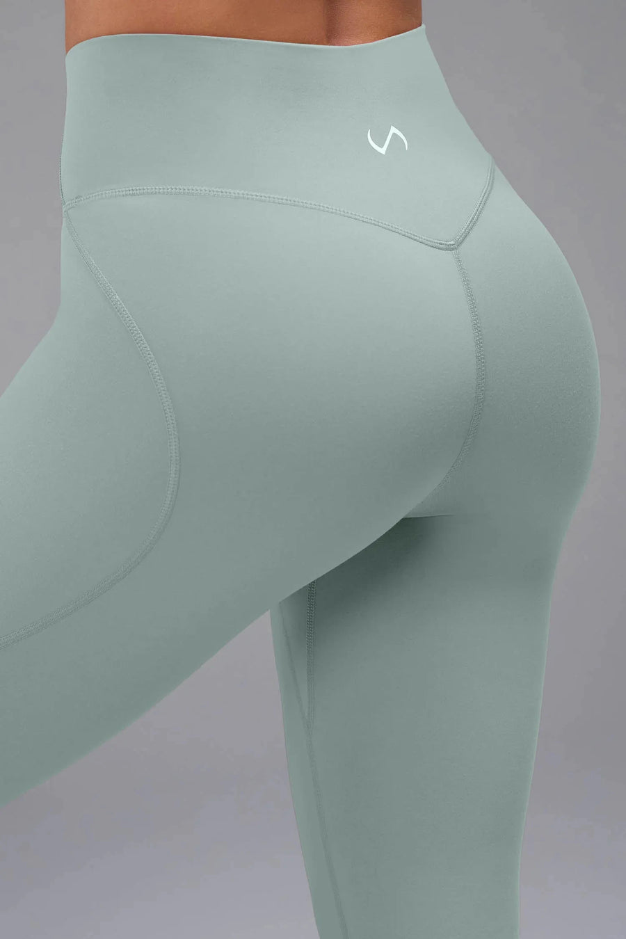 Back View of Green TLF Tempo Flare Leggings, featuring a waist snatching crossover waistband and glute shaping side seam 