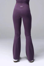 Back View of Purple TLF Tempo Flare Leggings, featuring a waist snatching crossover waistband and glute shaping side seam 