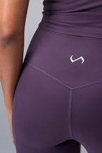 Front View of Purple TLF Tempo Flare Leggings, featuring a waist snatching crossover waistband and glute shaping side seam 