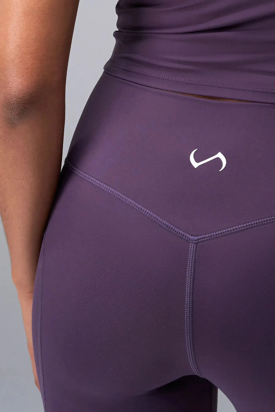 Front View of Purple TLF Tempo Flare Leggings, featuring a waist snatching crossover waistband and glute shaping side seam 