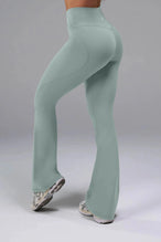 Back View of Green TLF Tempo Flare Leggings, featuring a waist snatching crossover waistband and glute shaping side seam 