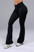 Front View of Black TLF Tempo Flare Leggings, featuring a waist snatching crossover waistband and glute shaping side seam 