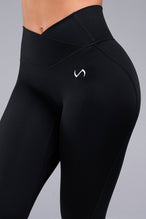 Front View of Black TLF Tempo Flare Leggings, featuring a waist snatching crossover waistband and glute shaping side seam 