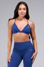 Front View of Oxford Blue TLF Tempo Front Clasp Sports Bra 2.0 with a strappy back and front closure, designed for style and support 