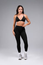 Front View of Black TLF Tempo Front Clasp Sports Bra 2.0 with a strappy back and front closure, designed for style and support 