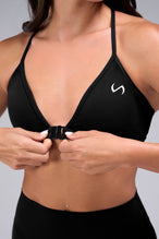 Zoomed Front View of Black TLF Tempo Front Clasp Sports Bra 2.0 with a strappy back and front closure, designed for style and support 