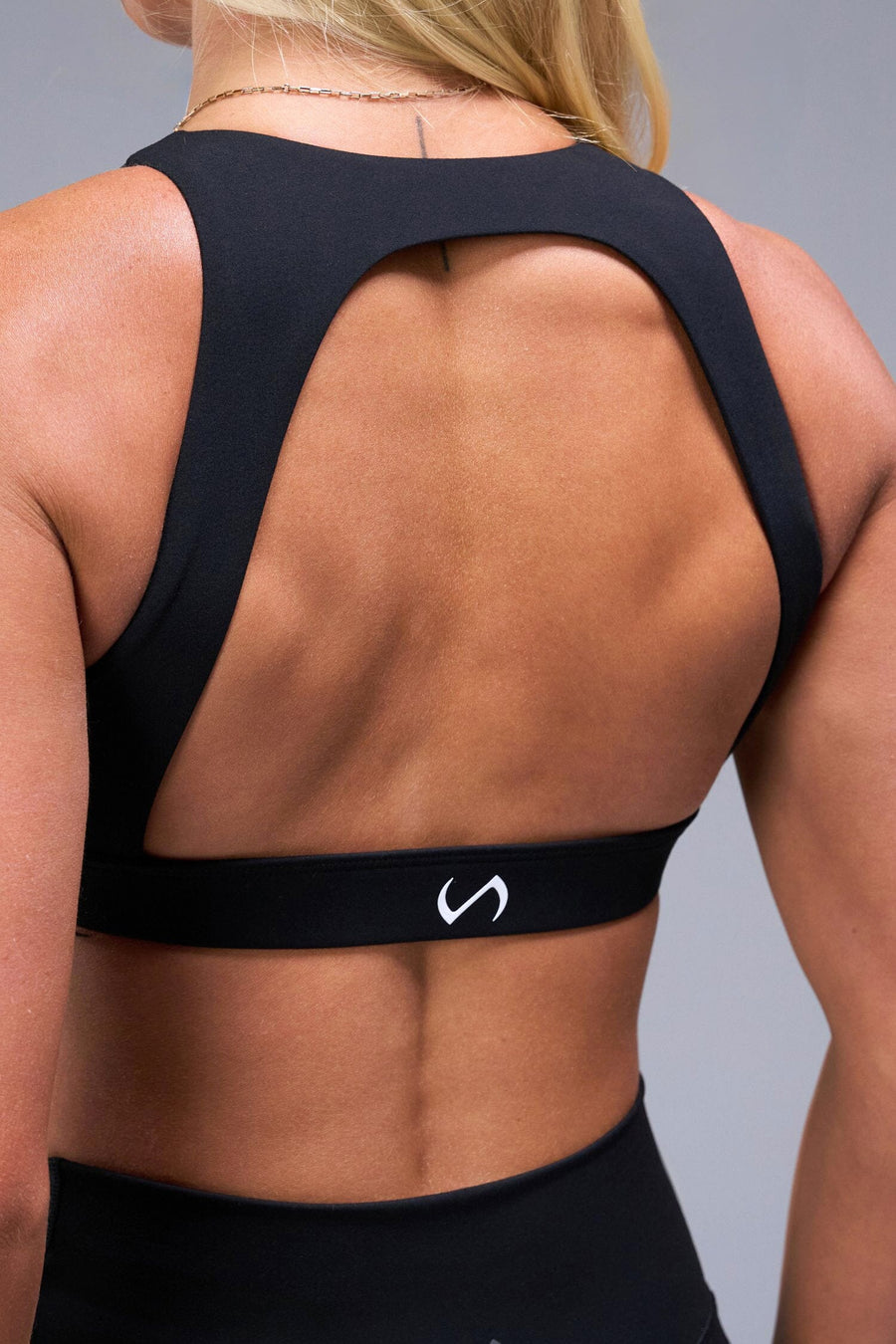 Back View of Black TLF Tempo High Neck Sports Bra, featuring a high neckline for high impact support during workouts, cardio and all day wear 