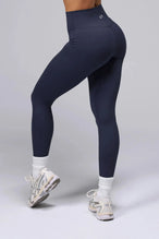 Side View Of Tempo High Waisted Workout Leggings in Armada