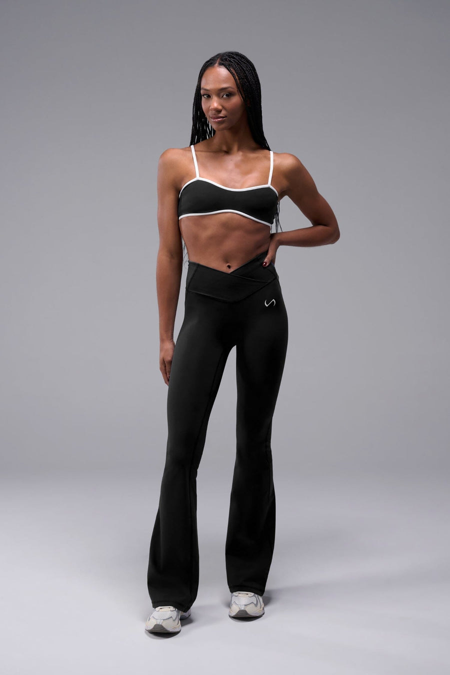 Front View of Black Tempo Minimal Bralette 2.0, featuring removable pads and adjustable straps for low impact all day wear