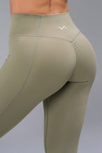 Back View of Brown TLF Tempo Scrunch Butt Leggings, featuring a butt scrunch that shapes your glutes with a snatched waist seam design 