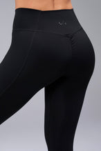 Back View of Black TLF Tempo Scrunch Butt Leggings, featuring a butt scrunch that shapes your glutes with a snatched waist seam design 