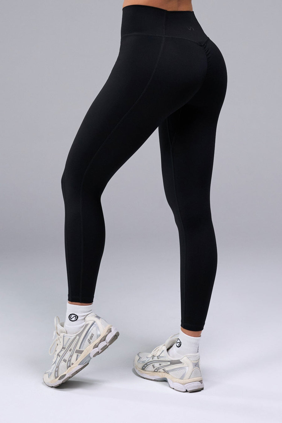 Back View of Black TLF Tempo Scrunch Butt Leggings, featuring a butt scrunch that shapes your glutes with a snatched waist seam design 
