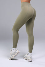 Side View of Brown TLF Tempo Scrunch Butt Leggings, featuring a butt scrunch that shapes your glutes with a snatched waist seam design 