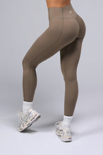 Back View of Brown TLF Tempo Scrunch Butt Leggings, featuring a butt scrunch that shapes your glutes with a snatched waist seam design 