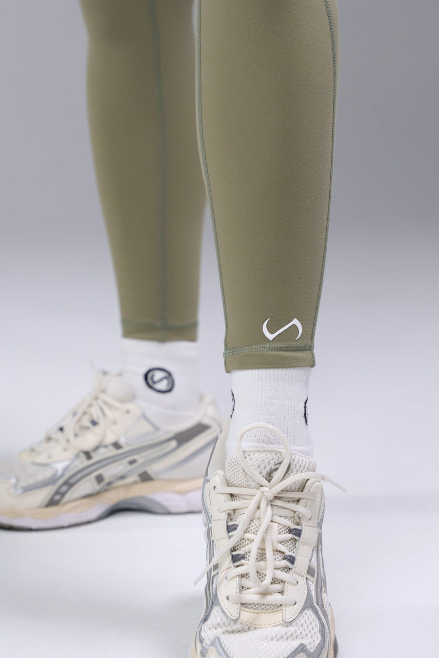 Detail Logo View of Brown TLF Tempo Scrunch Butt Leggings, featuring a butt scrunch that shapes your glutes with a snatched waist seam design 