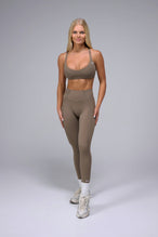 Front View of Brown TLF Tempo Scrunch Butt Leggings, featuring a butt scrunch that shapes your glutes with a snatched waist seam design 