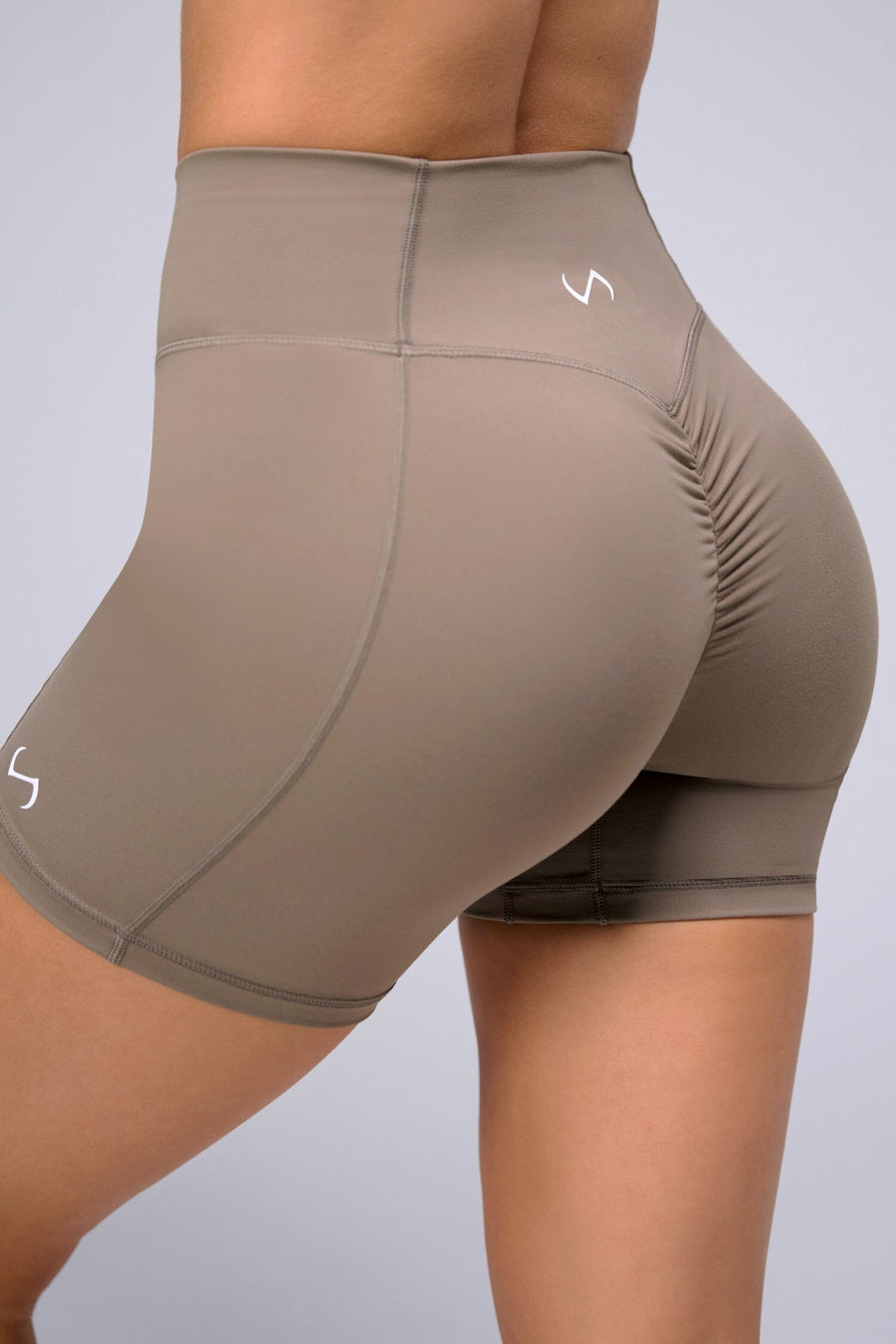 Back View of Brown TLF Tempo Scrunch Butt Shorts, featuring a butt scrunch that shapes your glutes with a snatched waist seam design 