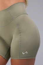 Front View of Brown TLF Tempo Scrunch Butt Shorts, featuring a butt scrunch that shapes your glutes with a snatched waist seam design 