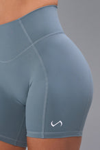 Detail Front View of Blue TLF Tempo Scrunch Butt Shorts, featuring a butt scrunch that shapes your glutes with a snatched waist seam design 