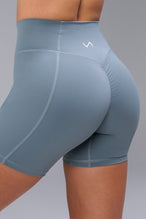Back View of Blue TLF Tempo Scrunch Butt Shorts, featuring a butt scrunch that shapes your glutes with a snatched waist seam design 