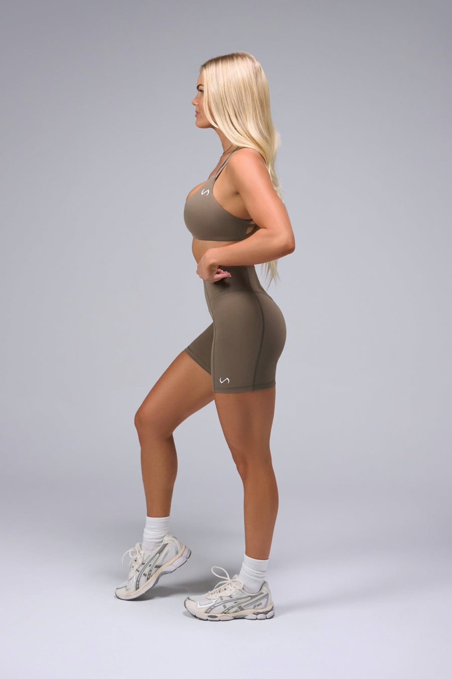 Left View of Brown TLF Tempo Scrunch Butt Shorts, featuring a butt scrunch that shapes your glutes with a snatched waist seam design 