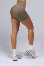 Side View of Brown TLF Tempo Scrunch Butt Shorts, featuring a butt scrunch that shapes your glutes with a snatched waist seam design 