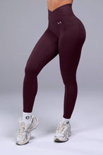 Side View of Wine TLF Tempo Side Pocket Leggings, featuring dual side pockets and crossover waistband for performance and functionality 