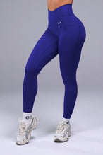 Side View of Blue TLF Tempo Side Pocket Leggings, featuring dual side pockets and crossover waistband for performance and functionality 