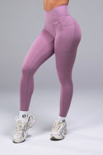 Front View of Purple TLF Tempo Side Pocket Leggings, featuring dual side pockets and crossover waistband for performance and functionality 