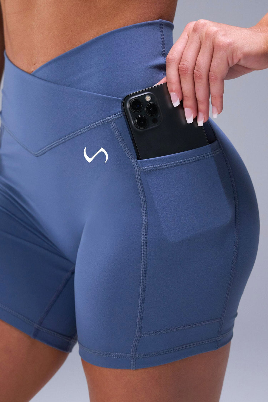 Detail Side View of Blue TLF Tempo Side Pocket Shorts, featuring dual side pockets and a 5’5’ Inch Inseam for performance and functionality 