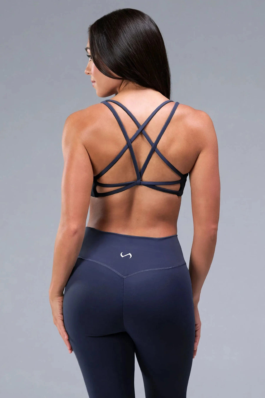 Back View of Blue TLF Tempo Strappy Back Sports Bra, featuring a minimal design for the gym and lifestyle wear 