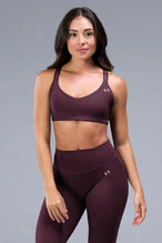 Front View of Wine TLF Tempo Strappy Back Sports Bra, featuring a minimal design for the gym and lifestyle wear 